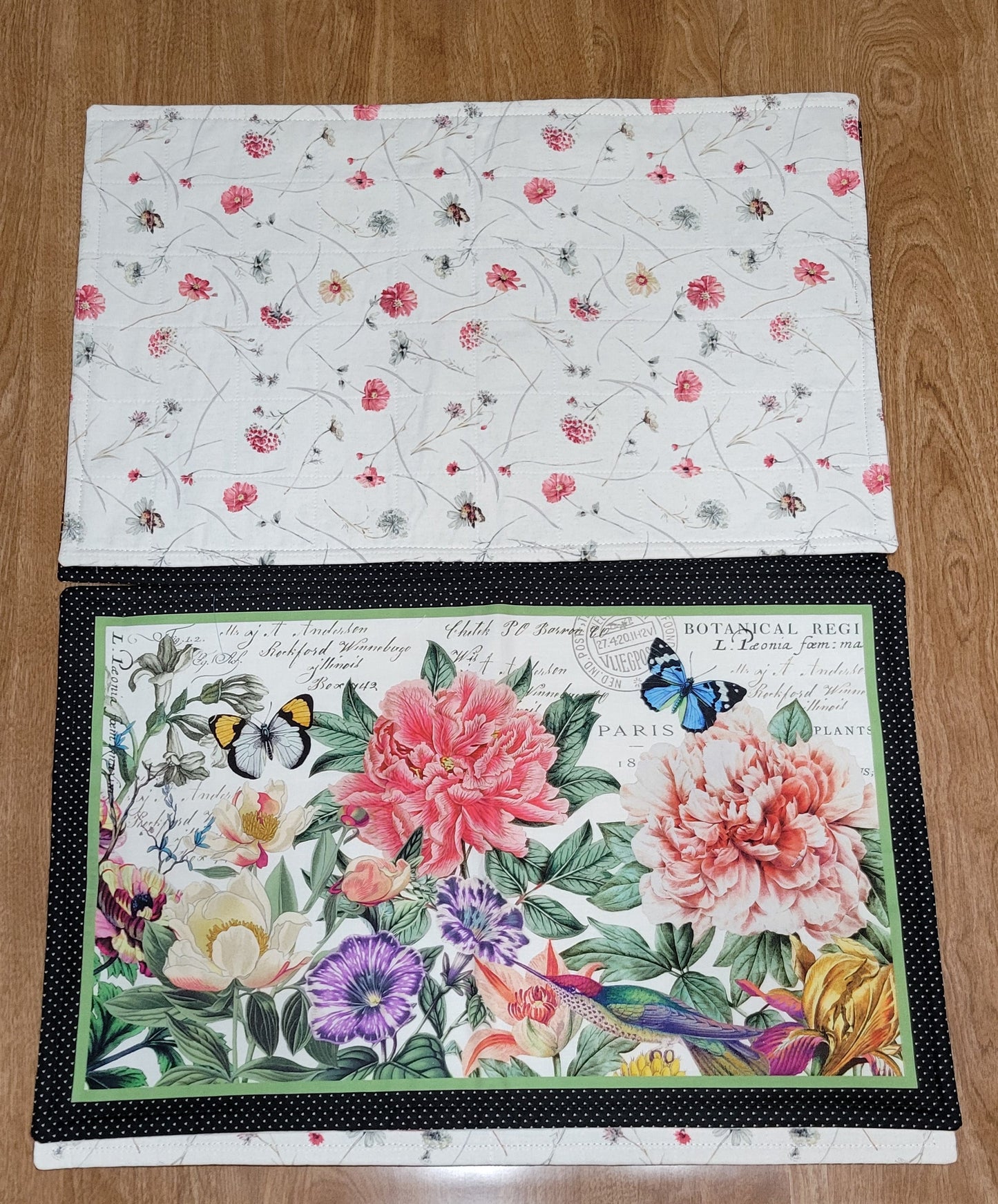 Floral-patterned placemats on a wooden table.
