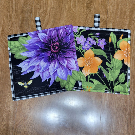 Floral-patterned dark-backed fabric on a wooden surface