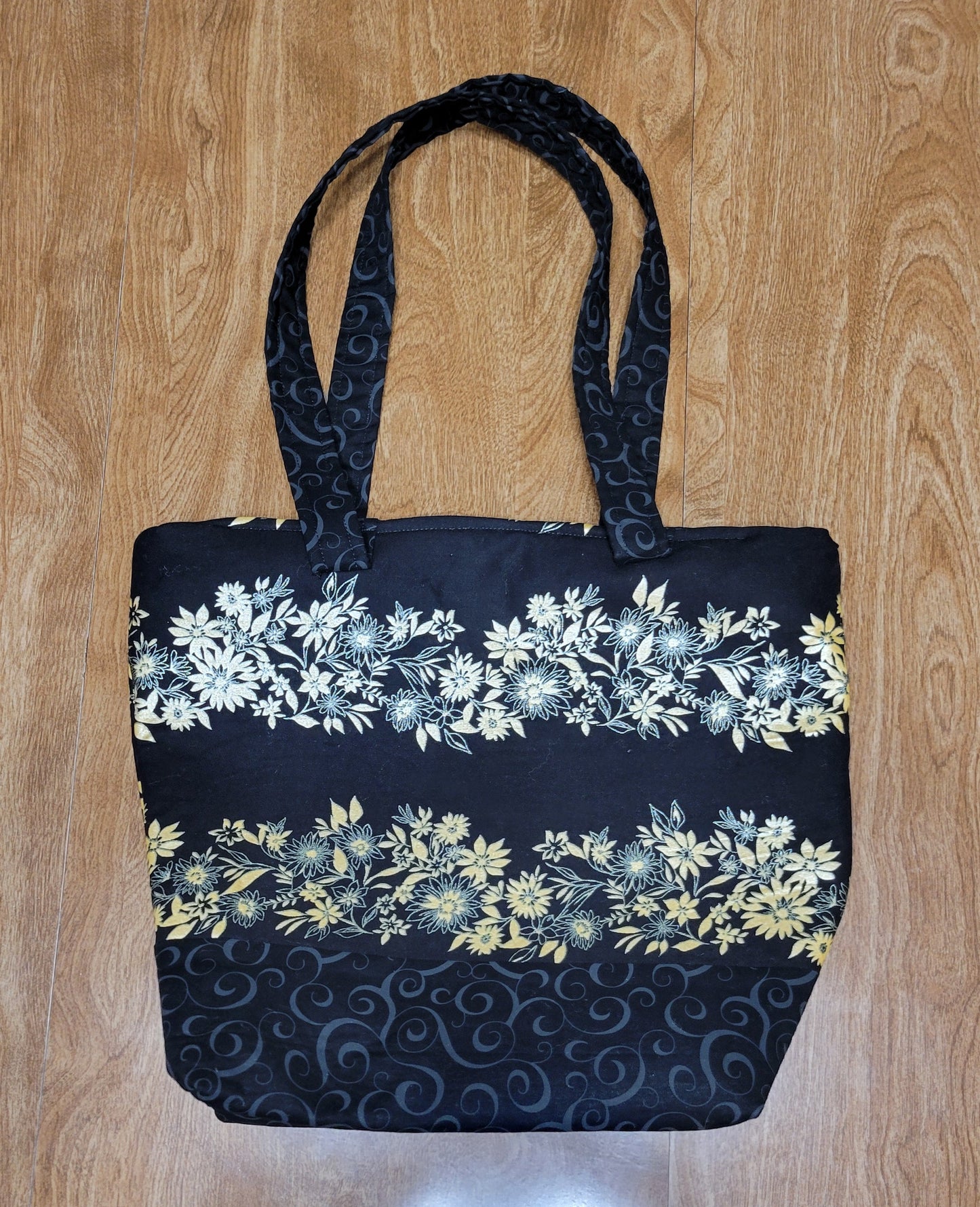 Floral-patterned bag on a wooden surface