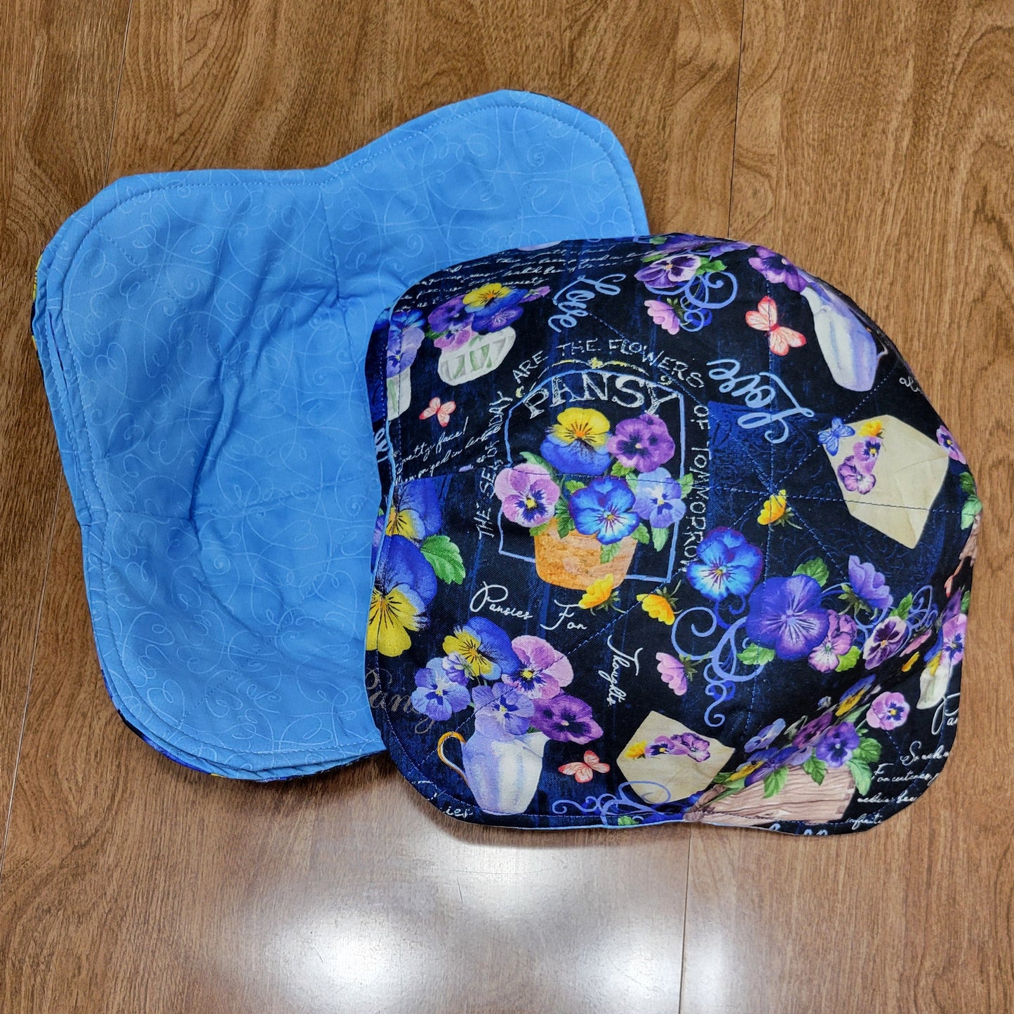 Colorful floral-patterned with a blue liner, on a wooden surface