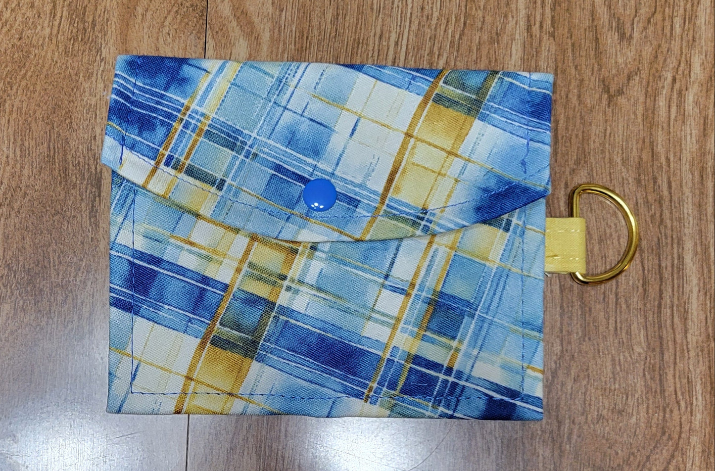 Plaid pouch on a wooden surface