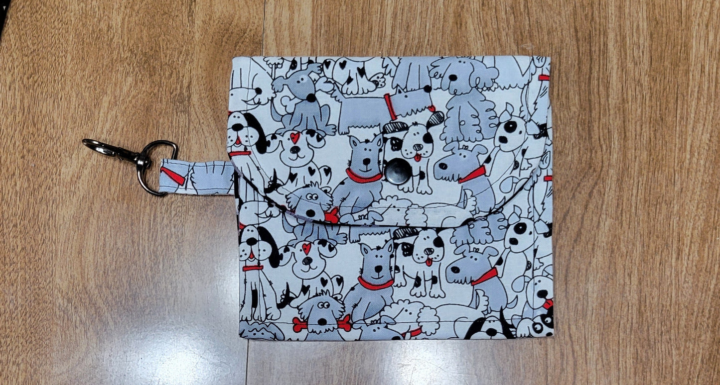 Dog themed patterned fabric on a wooden surface.