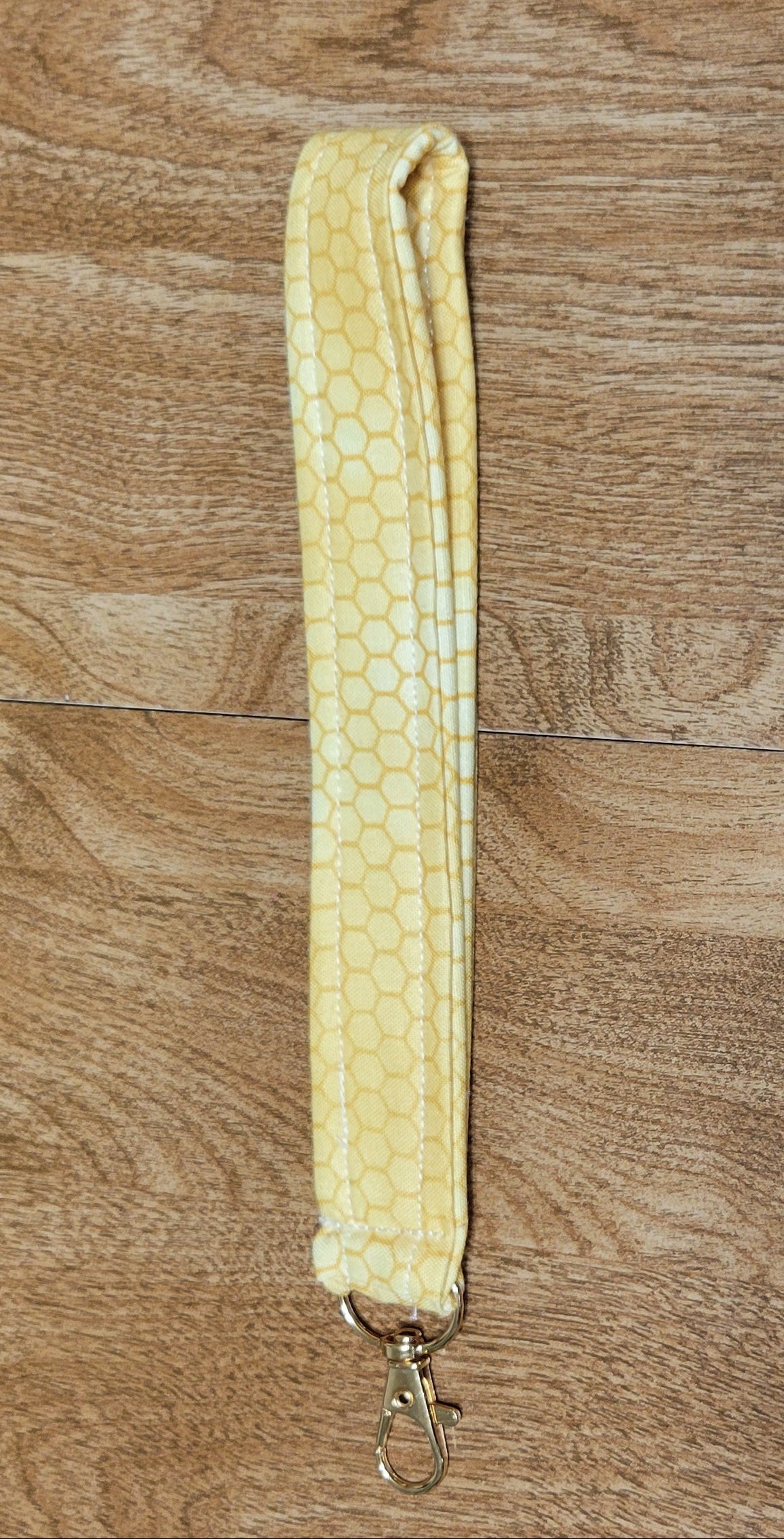 Yellow strap on a wooden surface