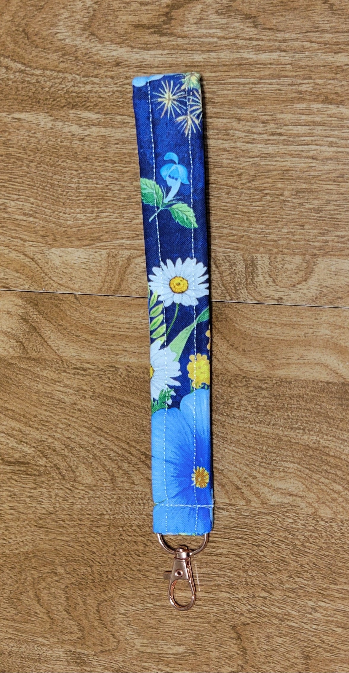 Floral-patterned strap on a wooden surface